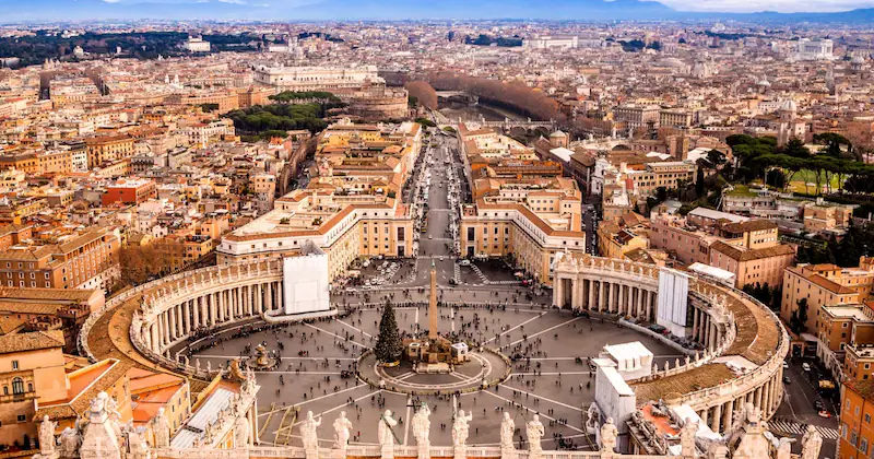Famous Saint Peter Square in Vatican and aerial view of the city